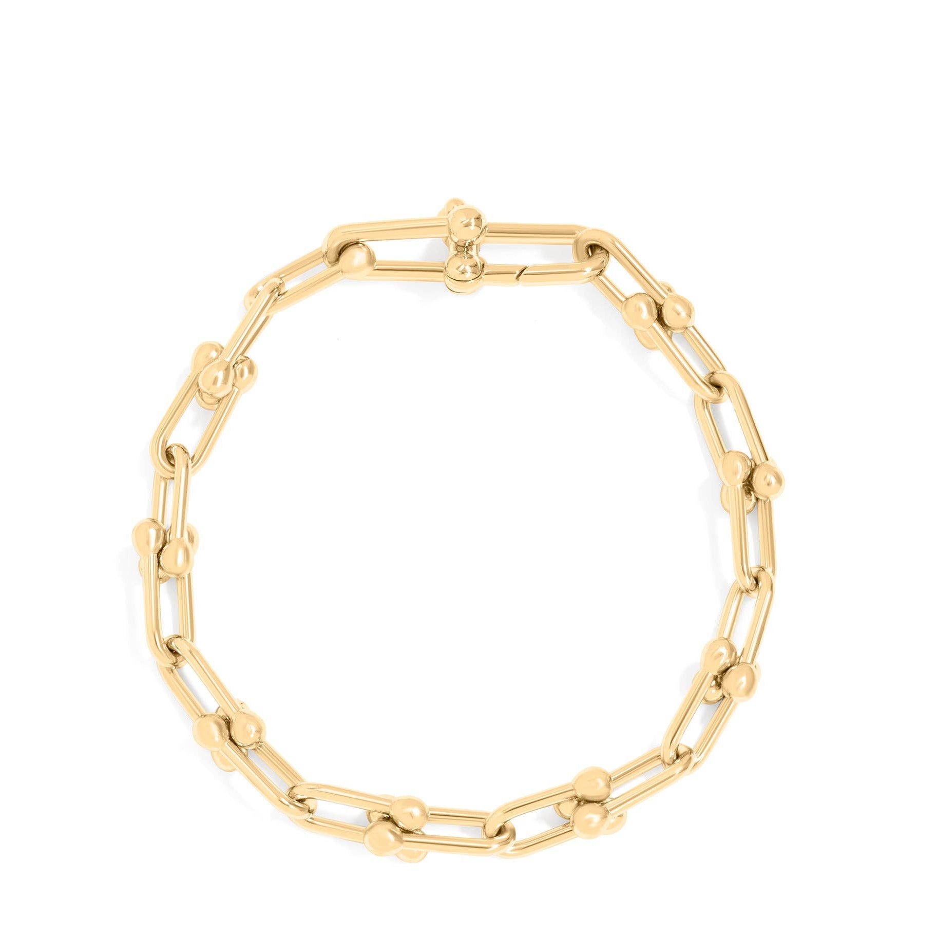 Gold chain bracelet on a black background
