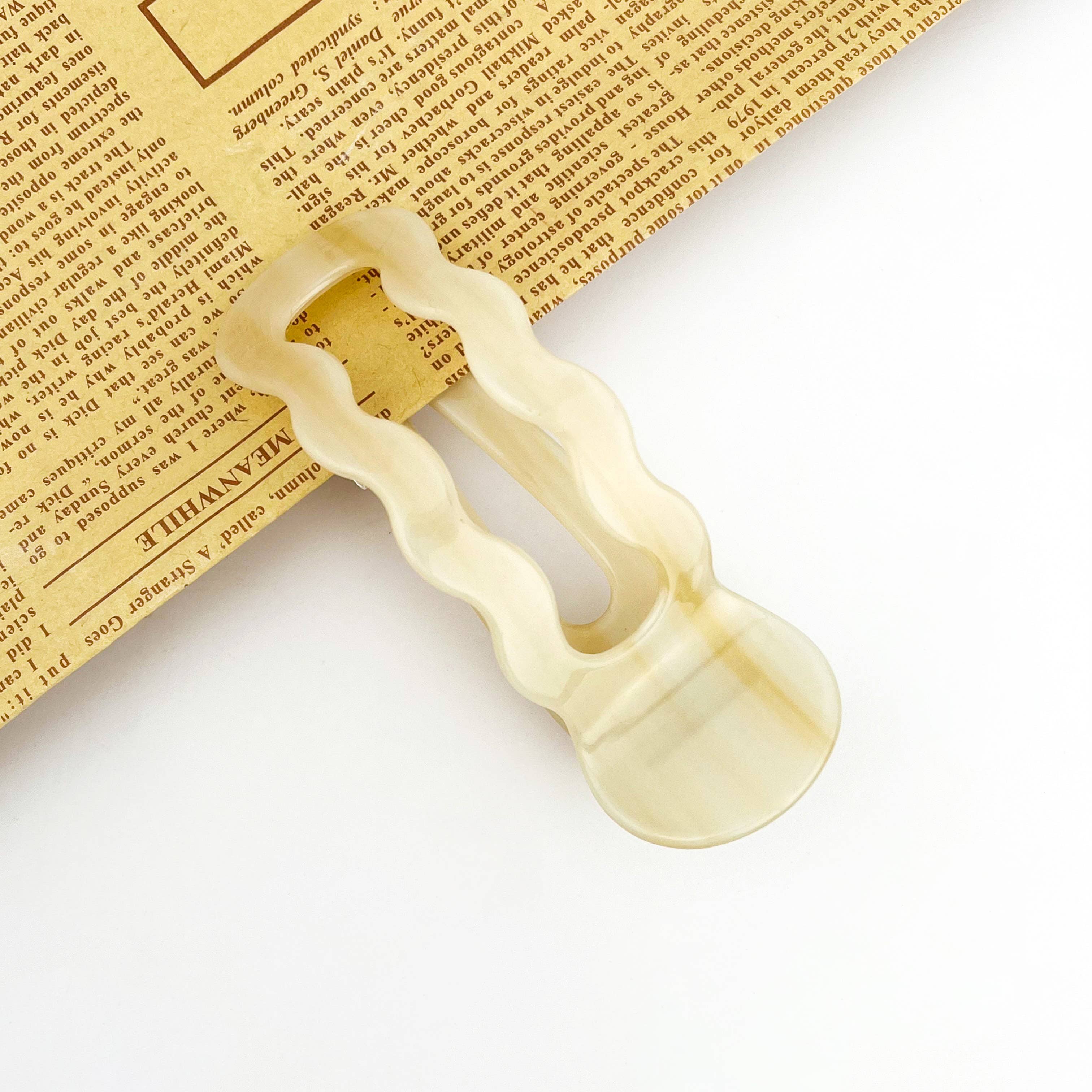 Decorative wooden letter 'A' on a textured surface with text overlay