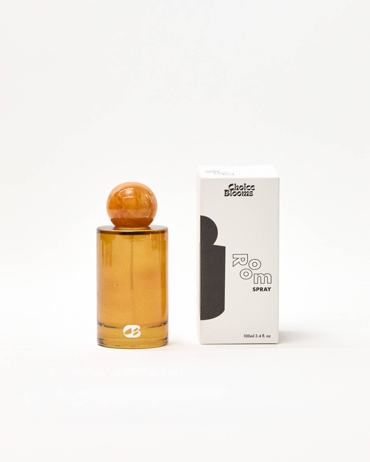 Amber perfume bottle with wooden cap and packaging on a white background