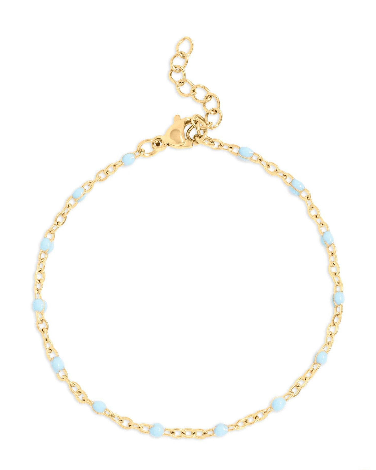 Gold bracelet with small blue beads on a white background