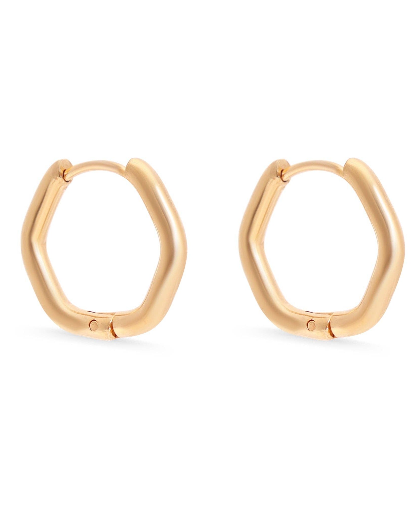 Gold hoop earrings on a white background