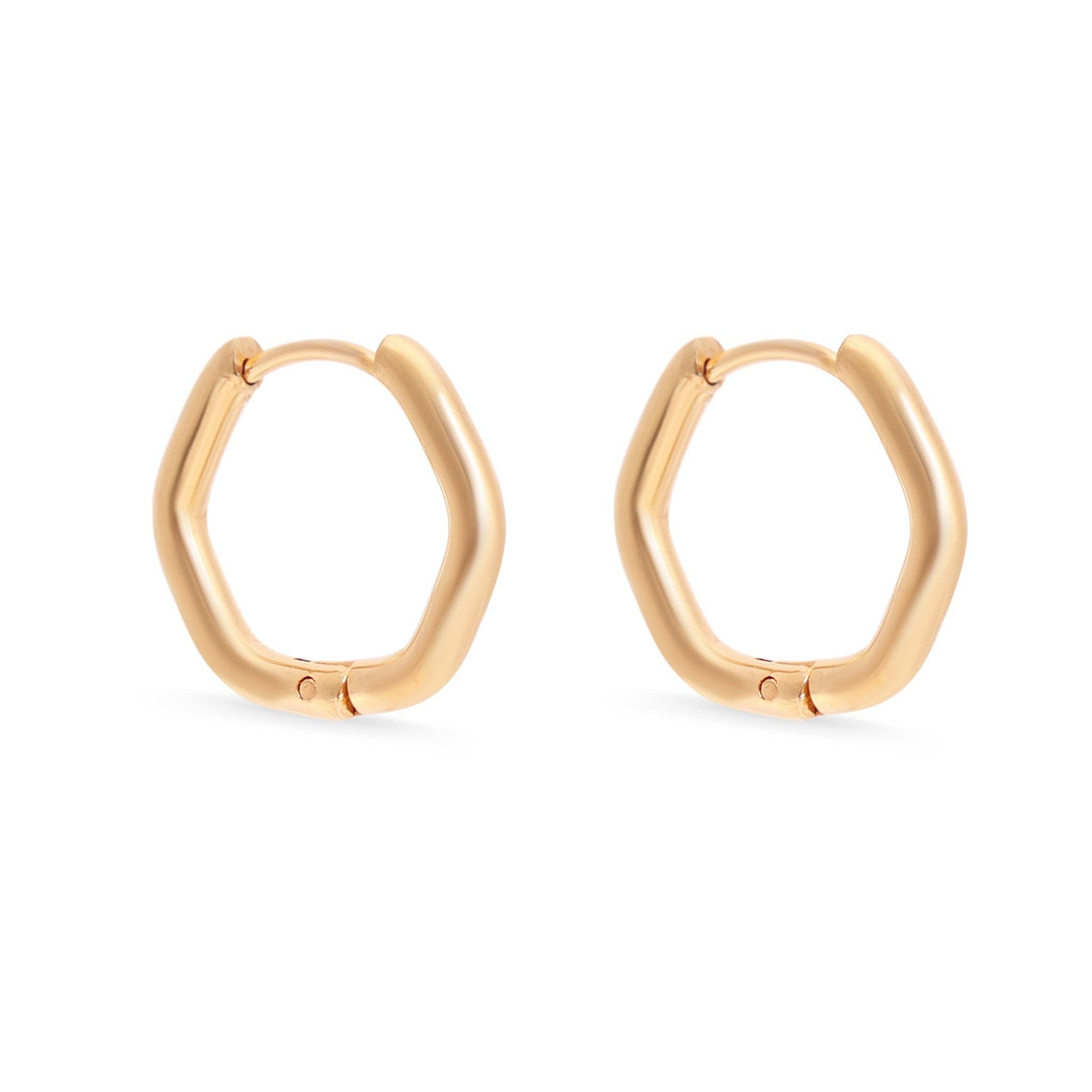 Gold hoop earrings on a white background
