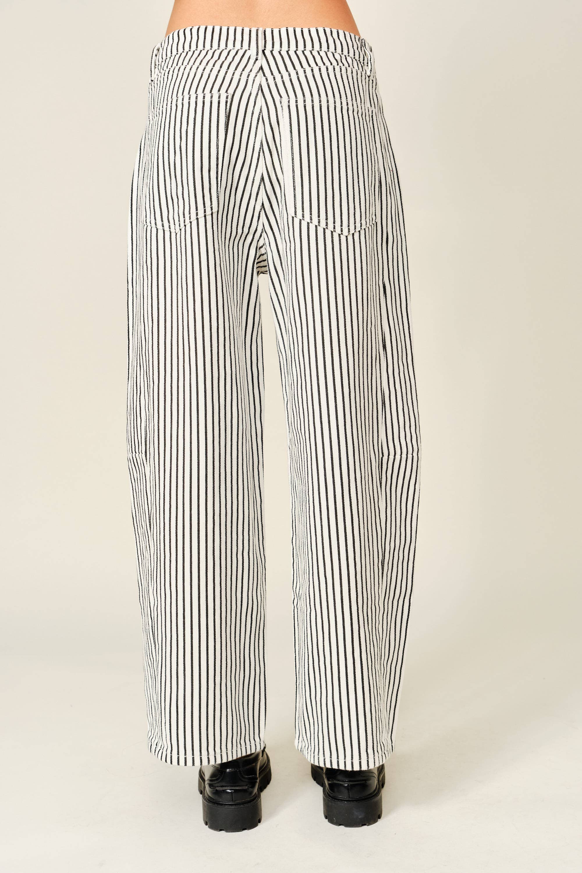 Black and white striped pants on a plain background