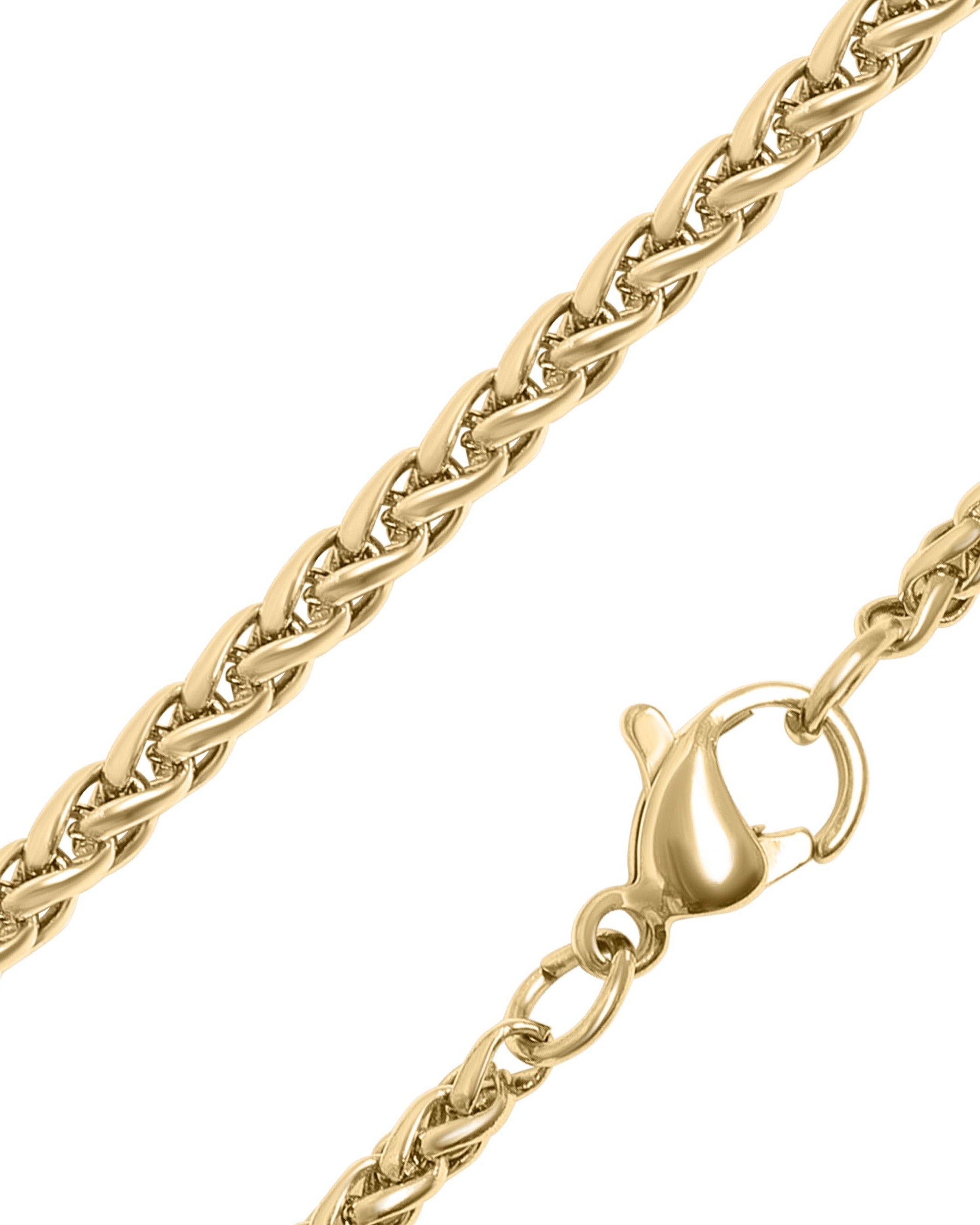 Gold chain necklace with a clasp on a white background