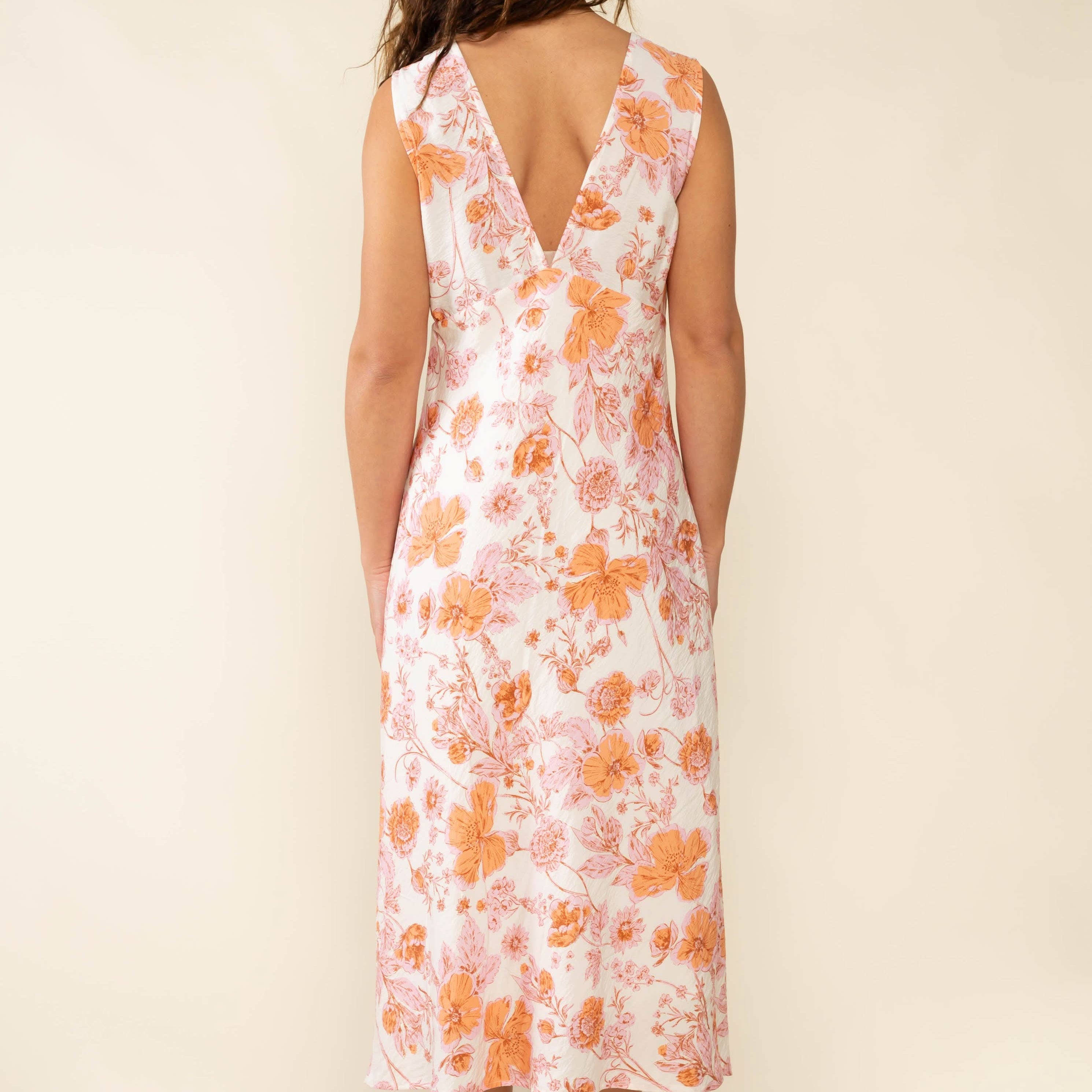 Woman wearing a floral dress Clara Bias Midi Dress - Made in L.A.