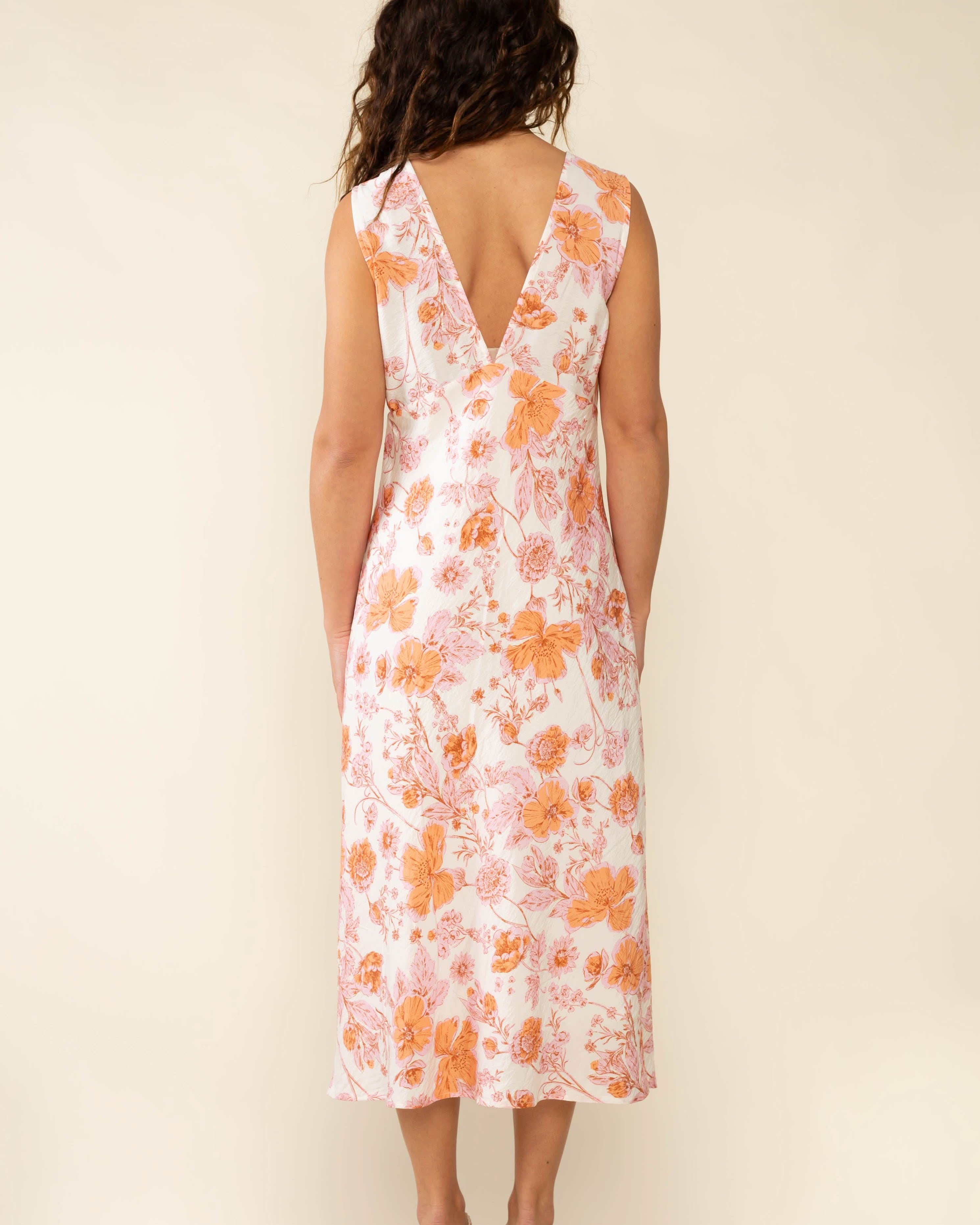 Woman wearing a floral dress Clara Bias Midi Dress - Made in L.A.