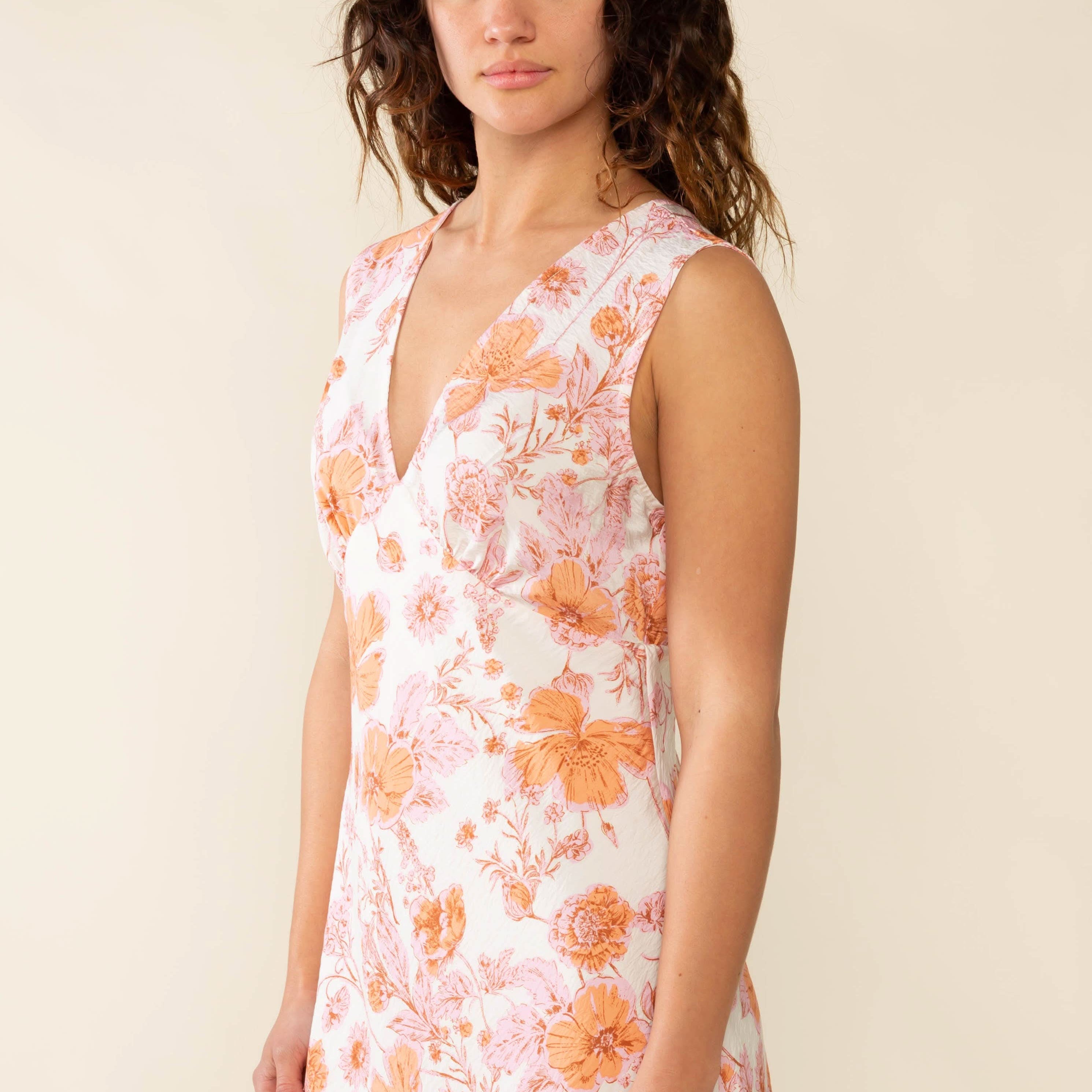 Woman wearing a floral dress Clara Bias Midi Dress - Made in L.A.