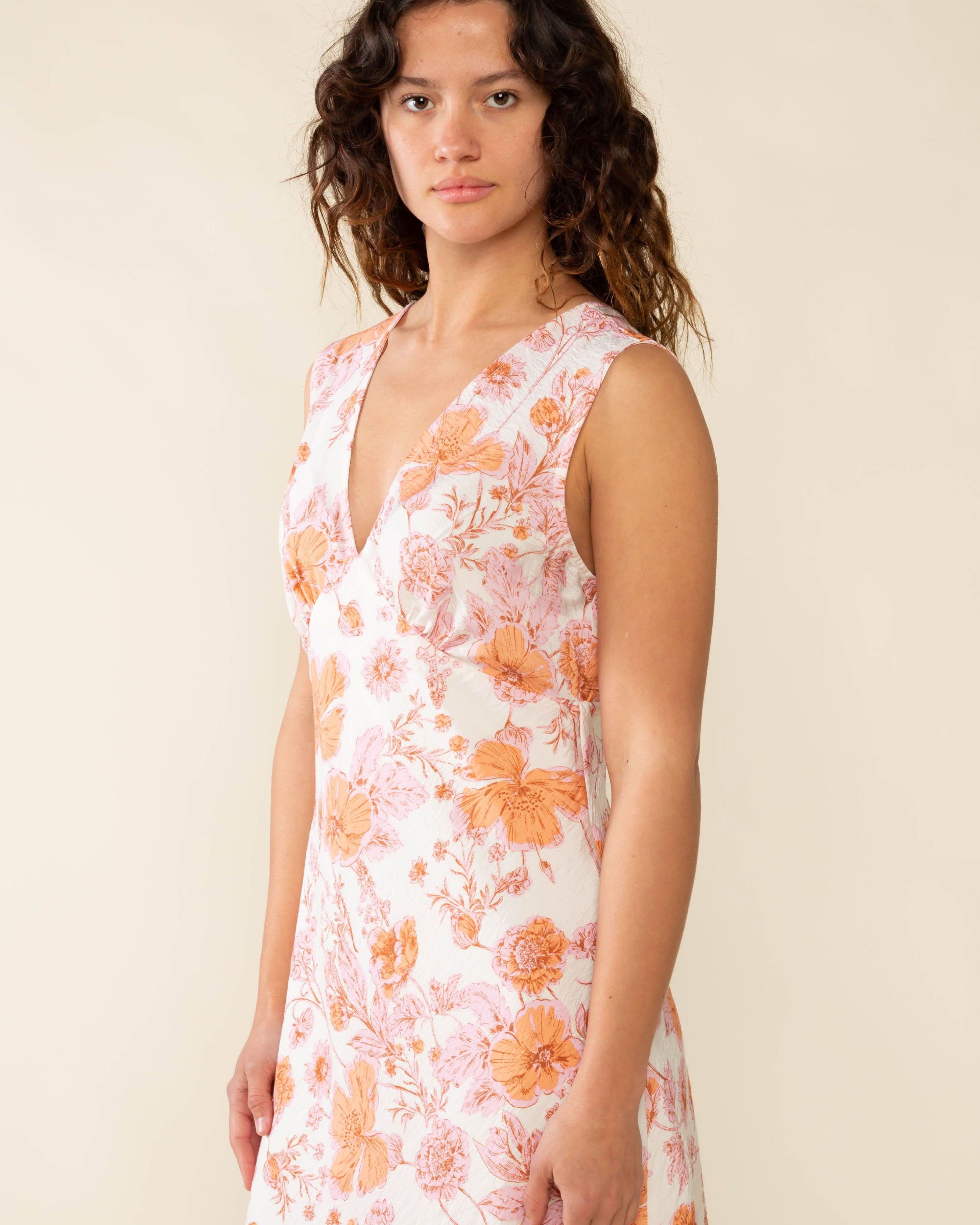 Woman wearing a floral dress Clara Bias Midi Dress - Made in L.A.