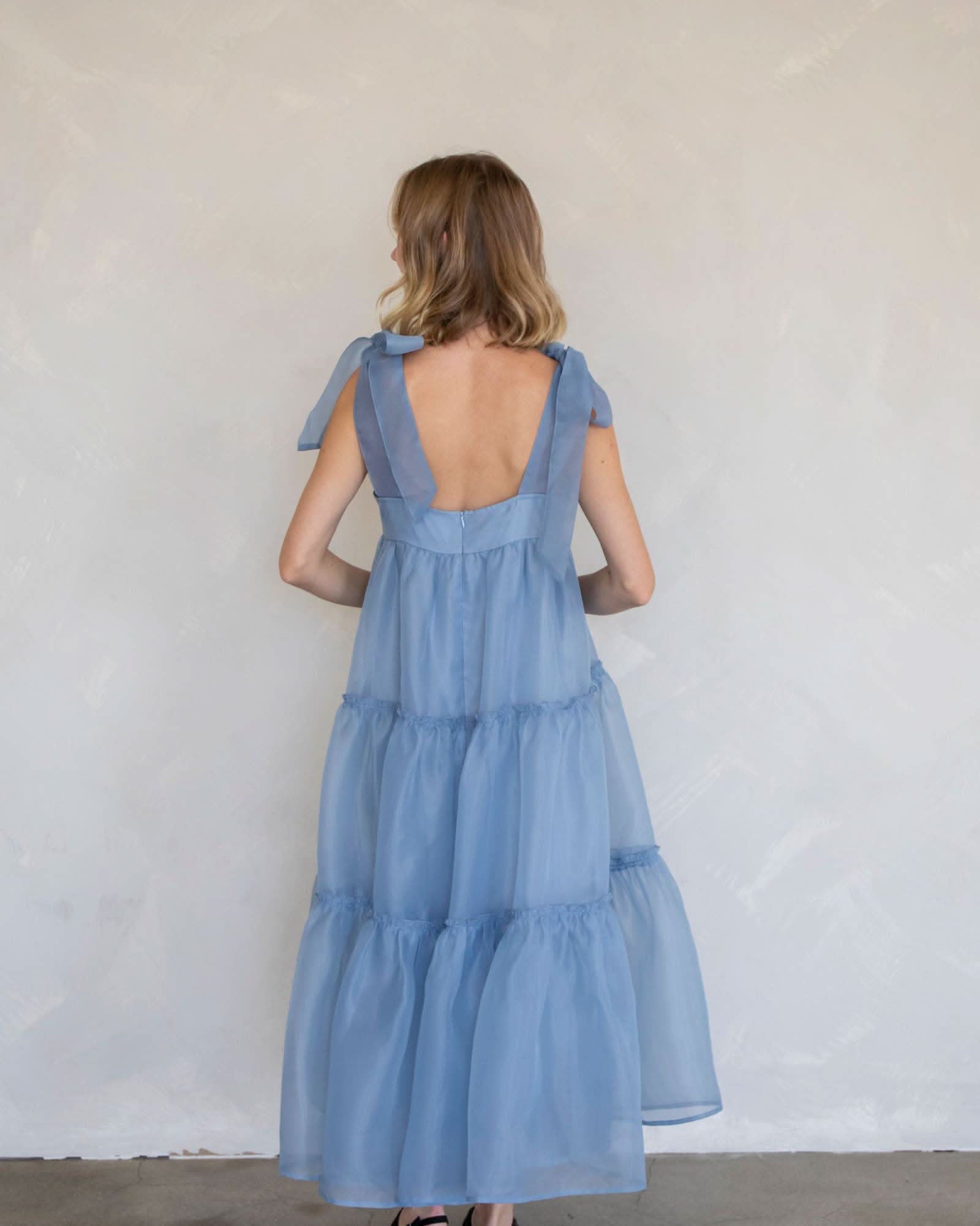 Ella Maxi Bow Strap Dress Woman wearing a blue dress