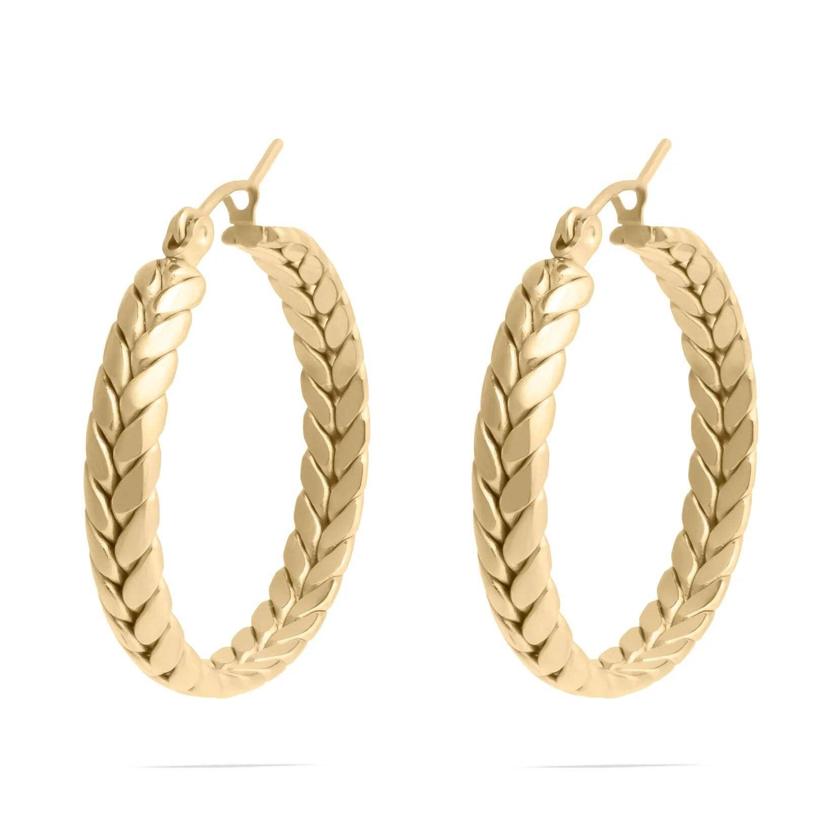 Gold hoop earrings on a white background