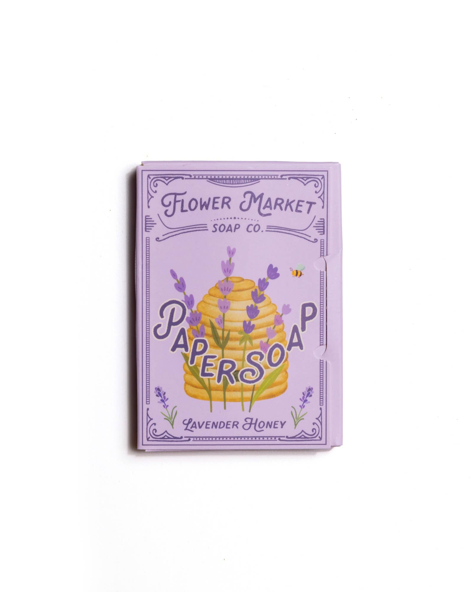 Flower Market Soap Co. lavender honey paper soap packaging on a white background