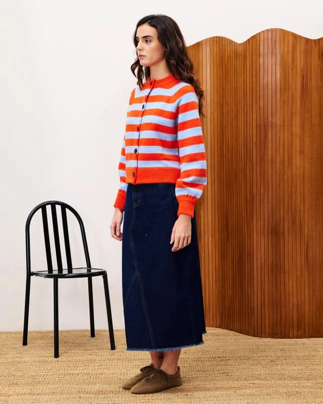Woman wearing a red and orange striped sweater
