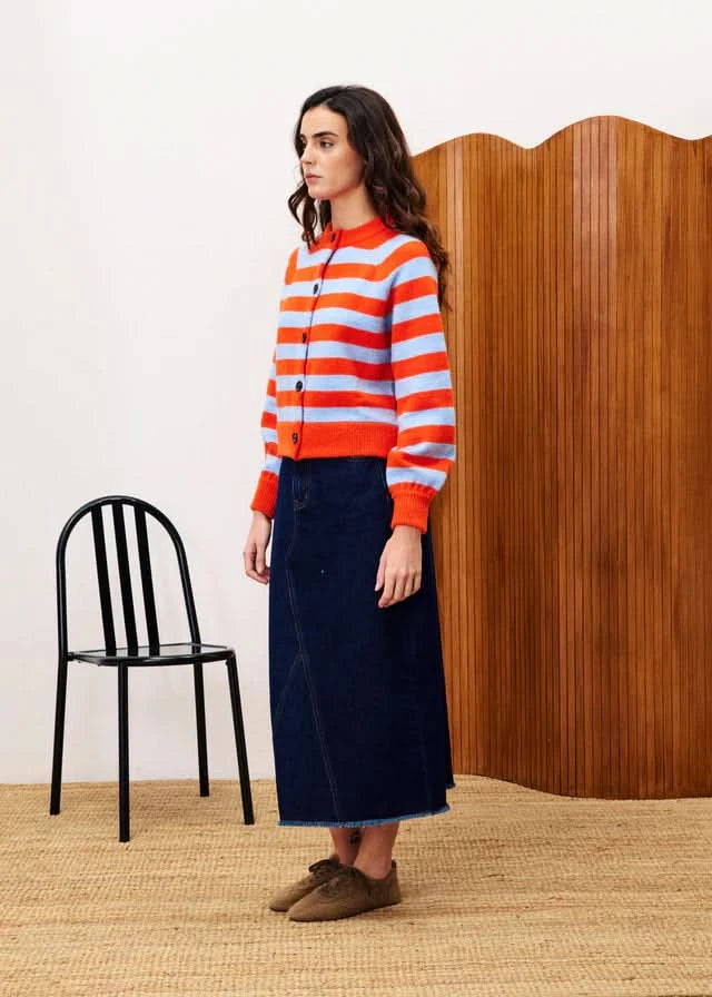 Woman wearing a red and orange striped sweater