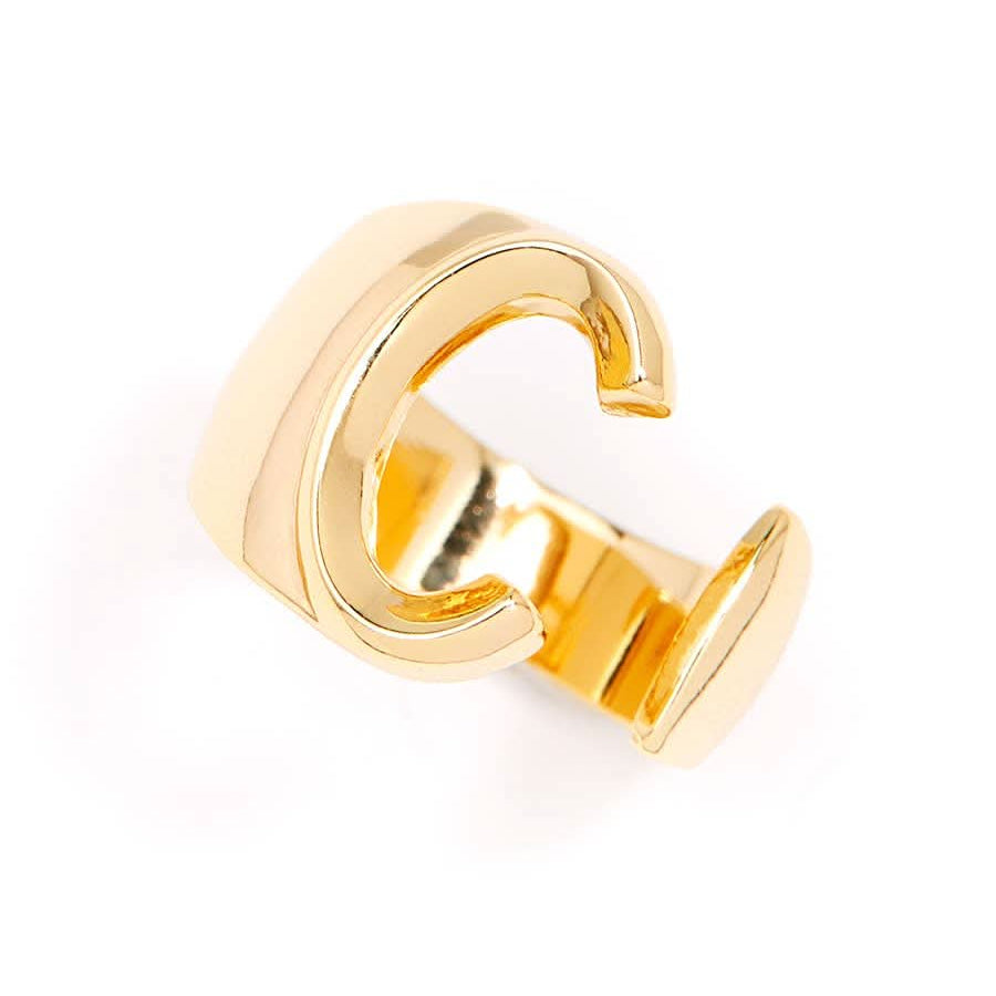 Gold adjustable letter ring on white background in letter C