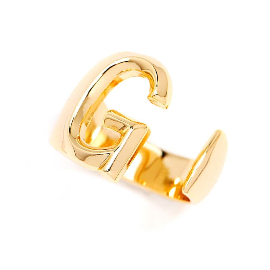 Gold adjustable letter ring on white background in letter G