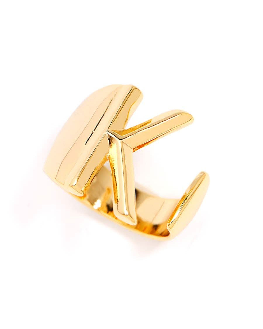 Gold adjustable letter ring on white background in letter K