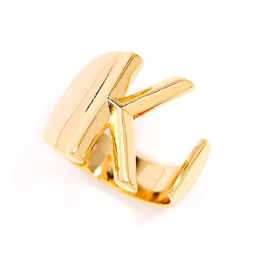 Gold adjustable letter ring on white background in letter K