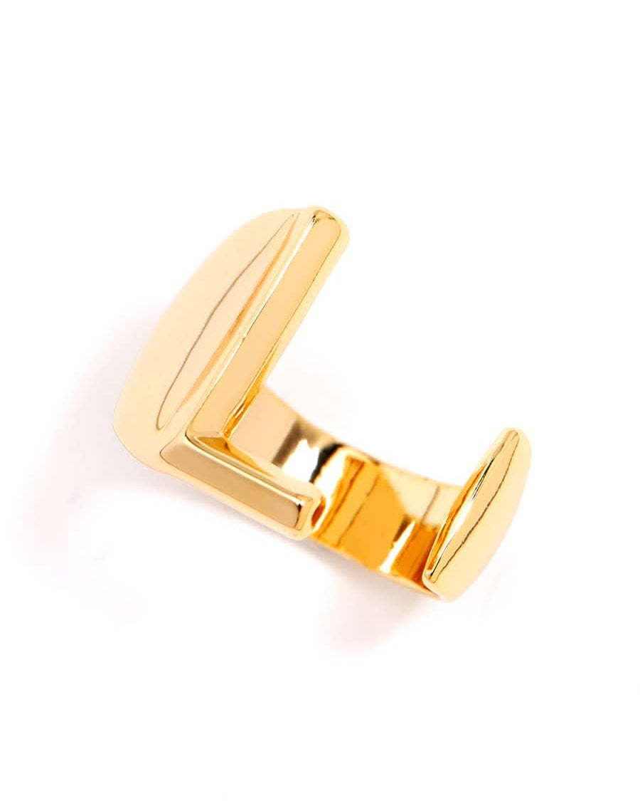 Gold adjustable letter ring on white background in letter L