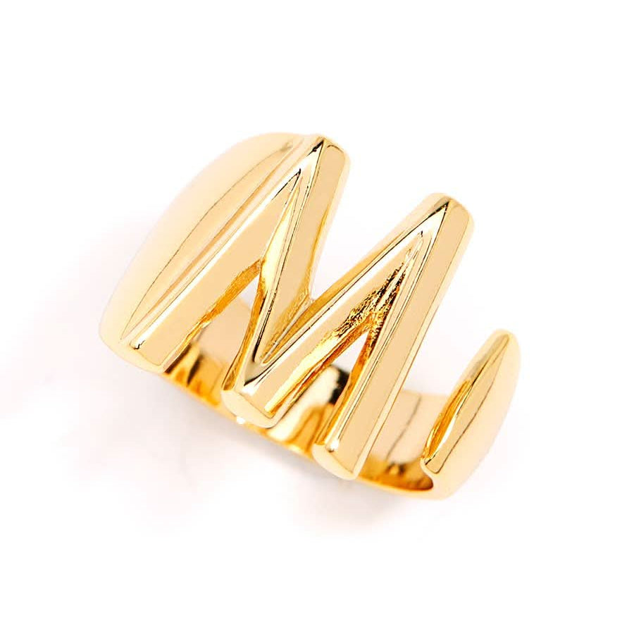 Gold adjustable letter ring on white background in letter M