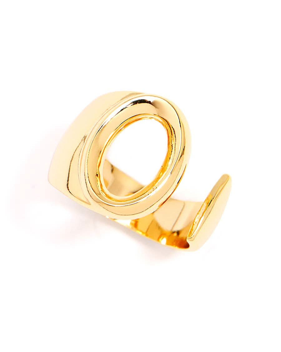 Gold adjustable letter ring on white background in letter o