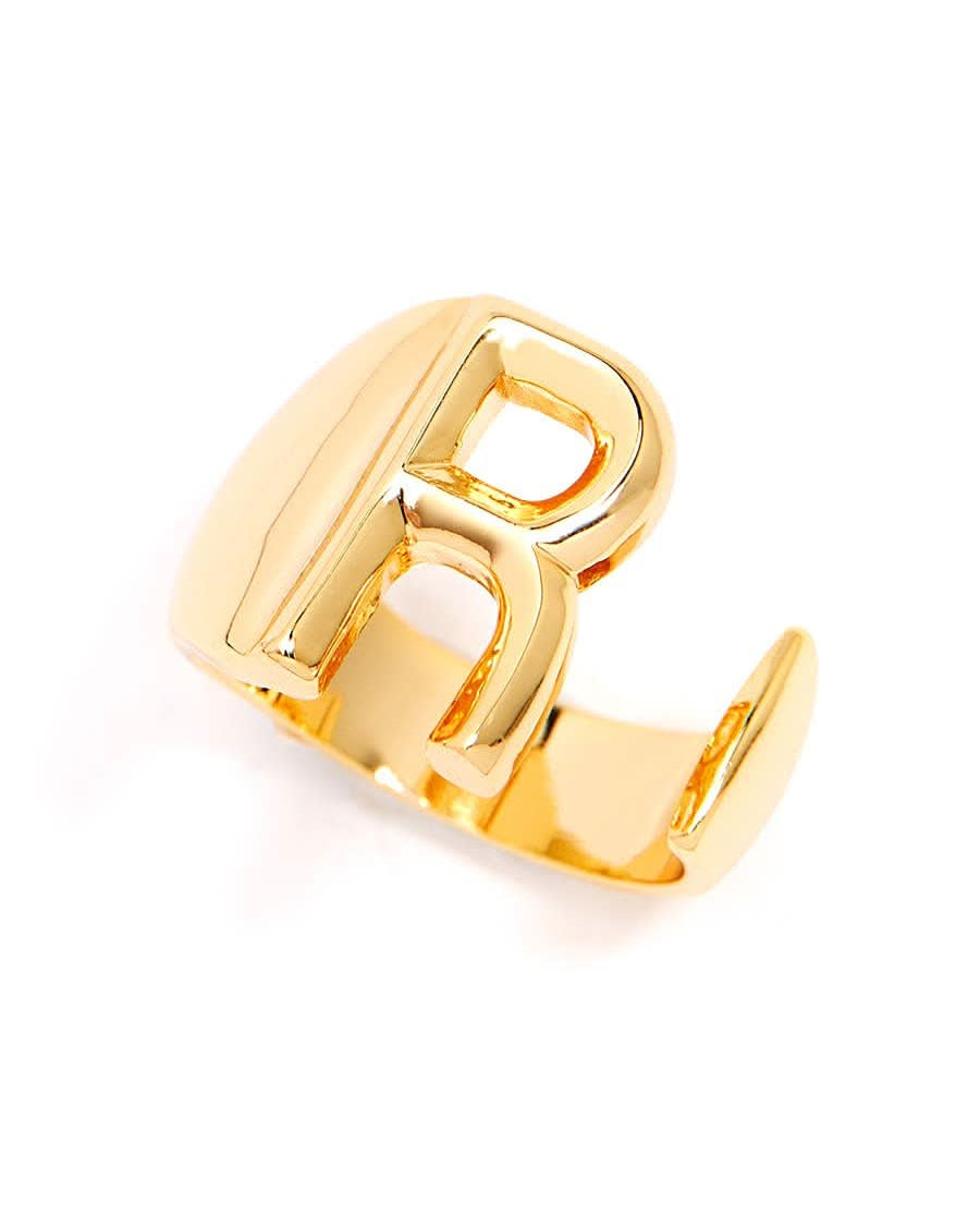 Gold adjustable letter ring on white background in letter R