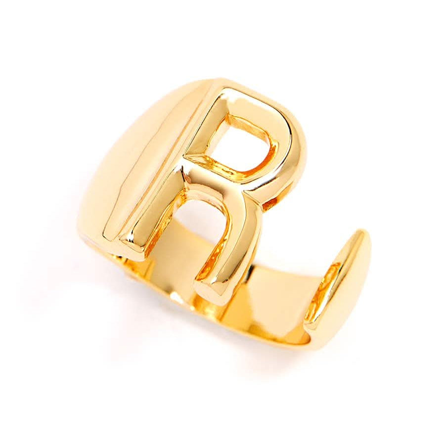 Gold adjustable letter ring on white background in letter R