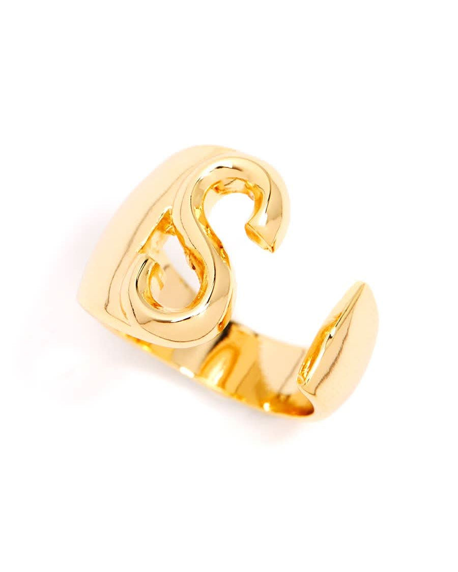 Gold adjustable letter ring on white background in letter S