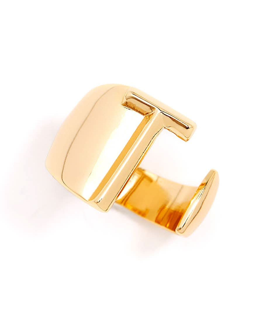 Gold adjustable letter ring on white background in letter T