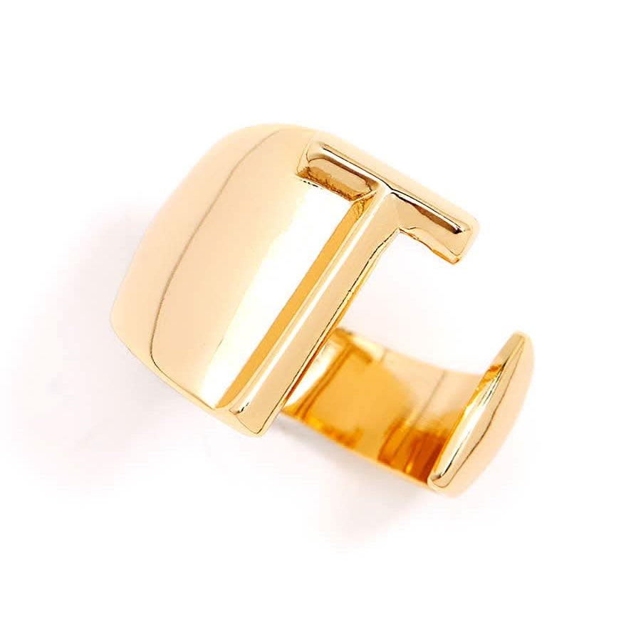 Gold adjustable letter ring on white background in letter T