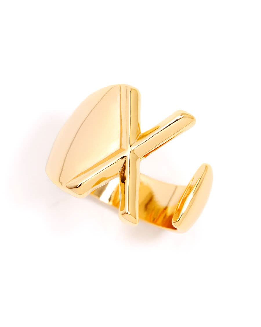 Gold adjustable letter ring on white background in letter X