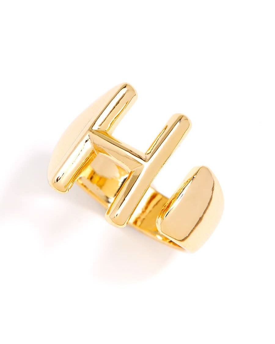 Gold adjustable letter ring on white background in letter H