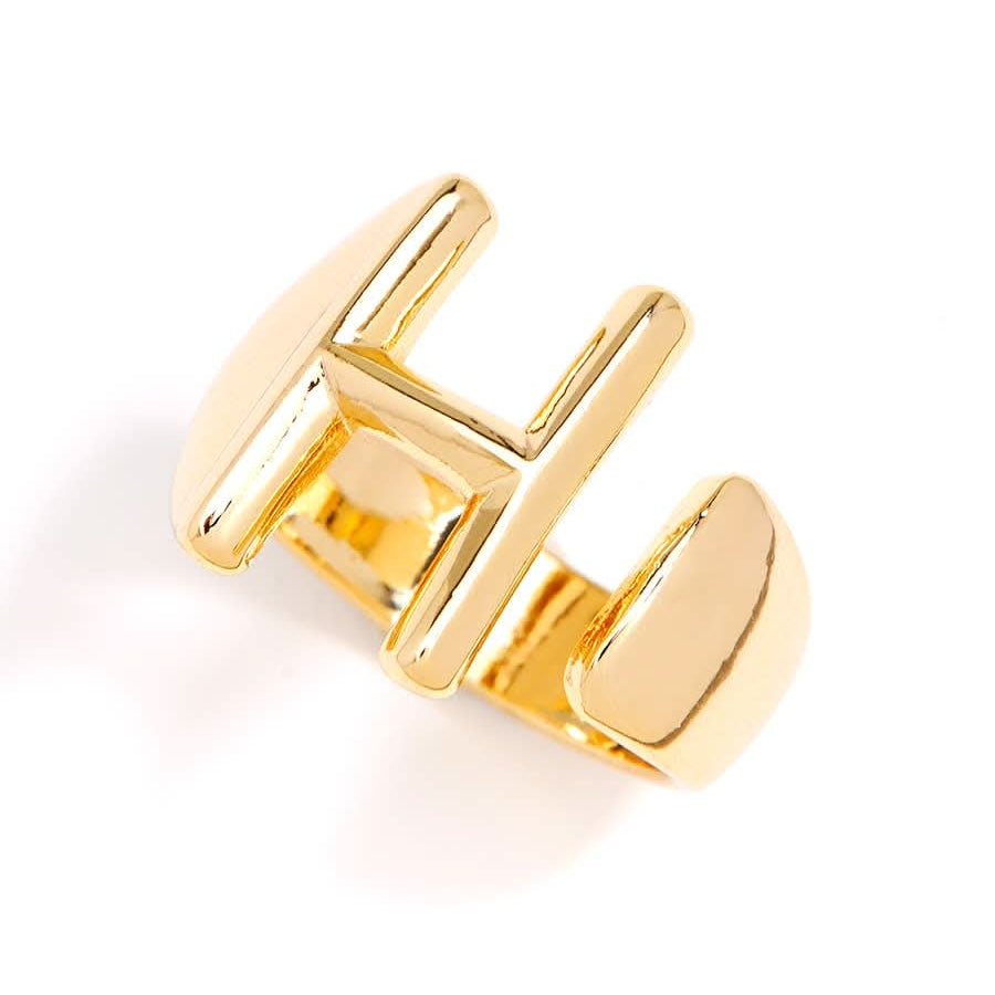 Gold adjustable letter ring on white background in letter H