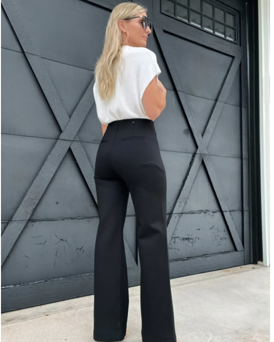 Made from soft fabric, these wide-leg pants feature double buttons for a unique touch.