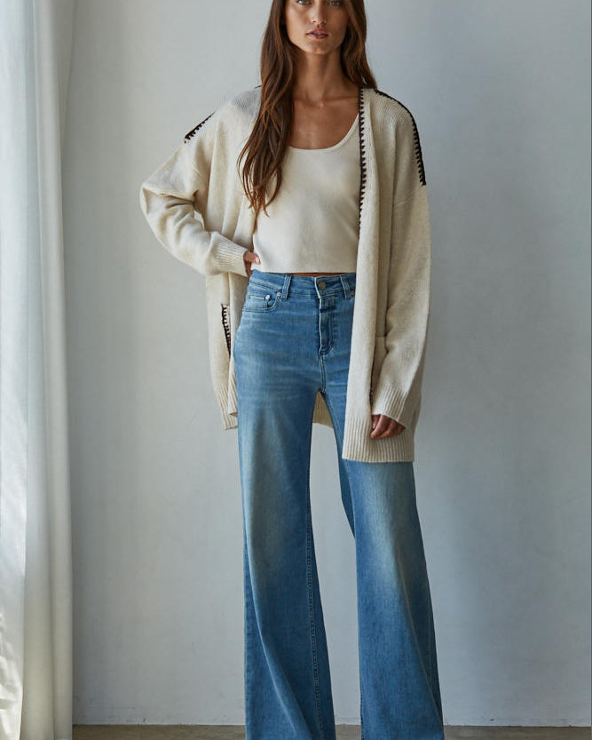 Woman wearing a beige cardigan, Lotte Contrast Stitch Open Cardigan