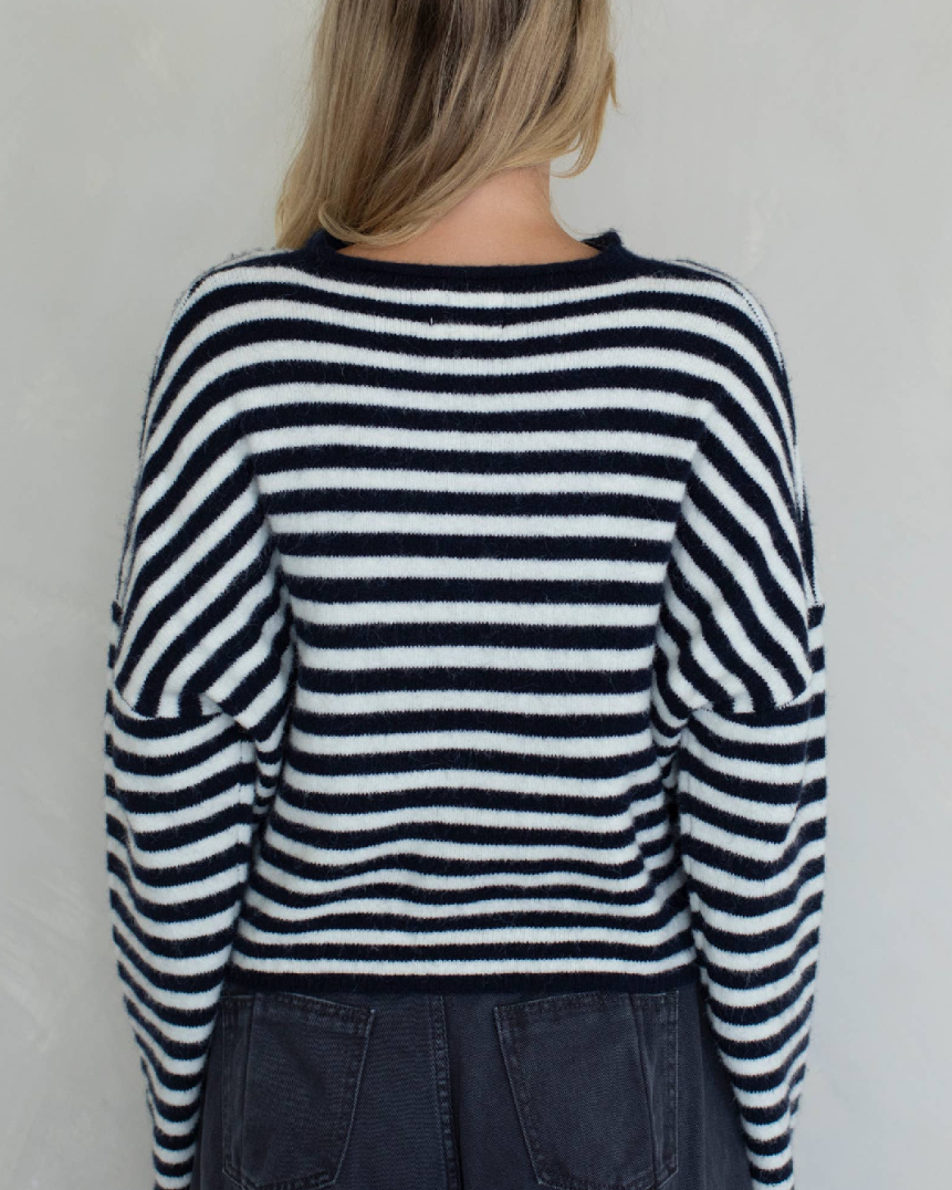 Person wearing a black and white striped sweater