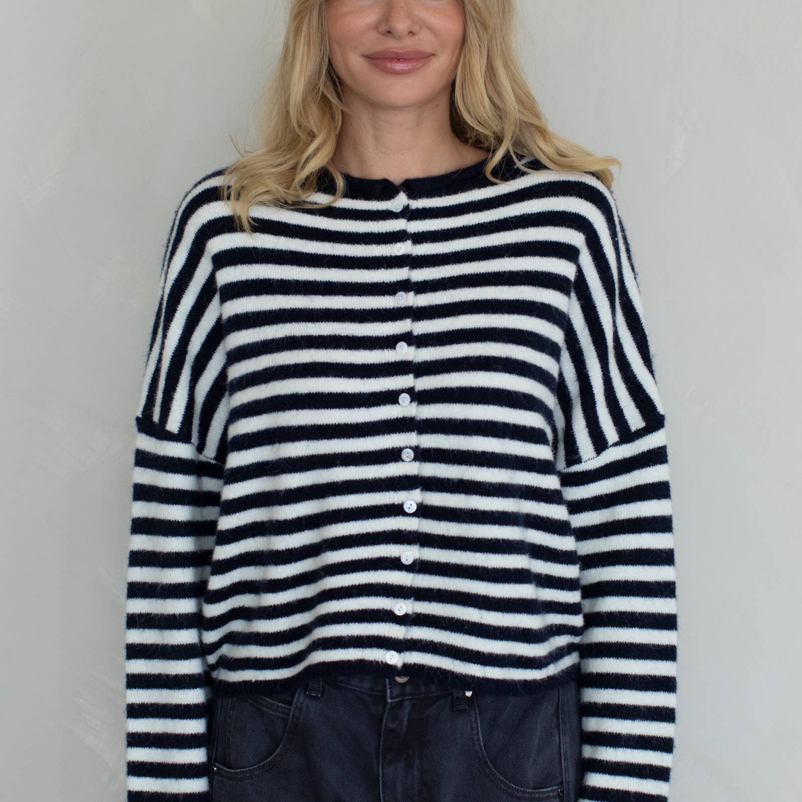 Woman wearing a black and white striped sweater