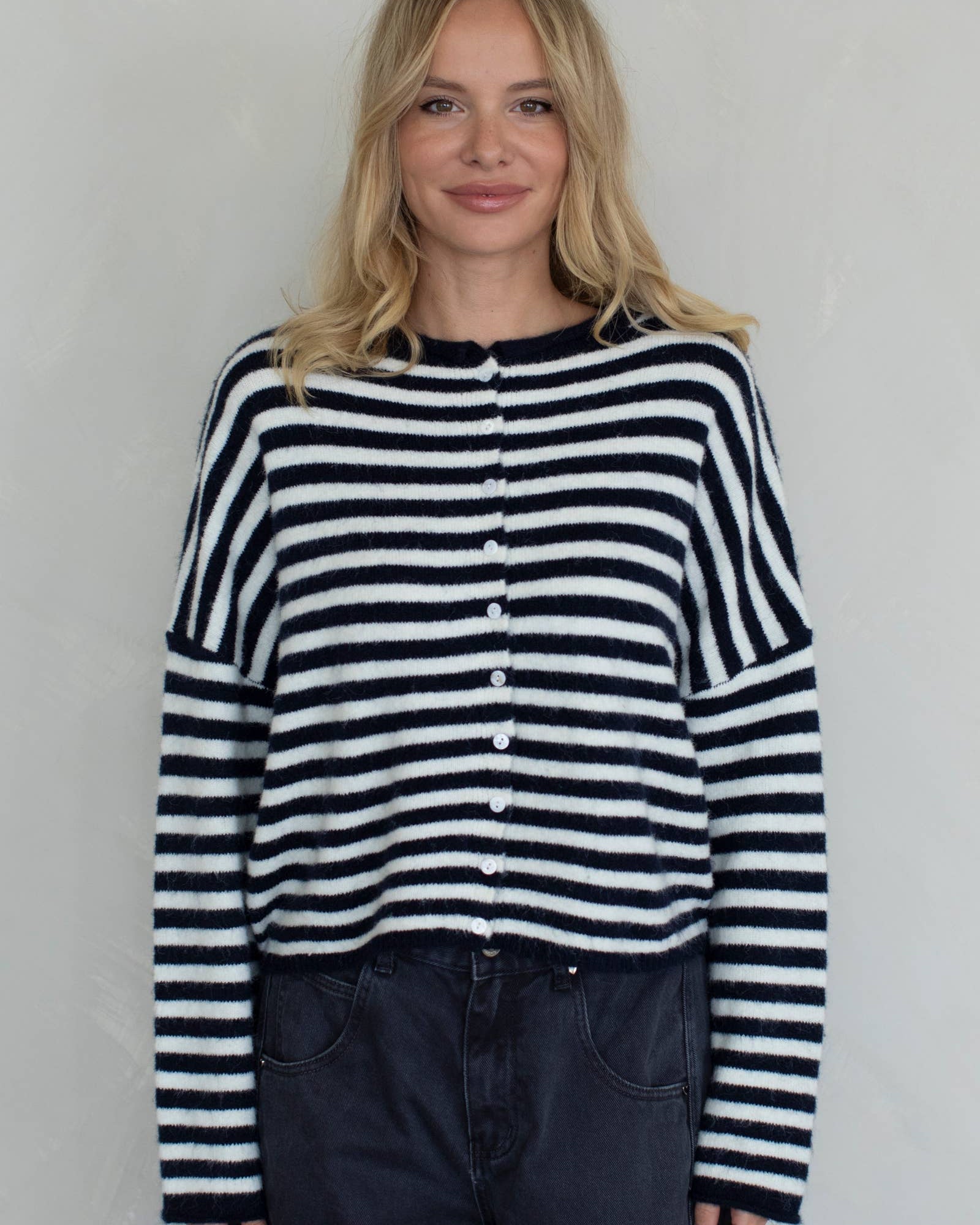 Woman wearing a black and white striped sweater