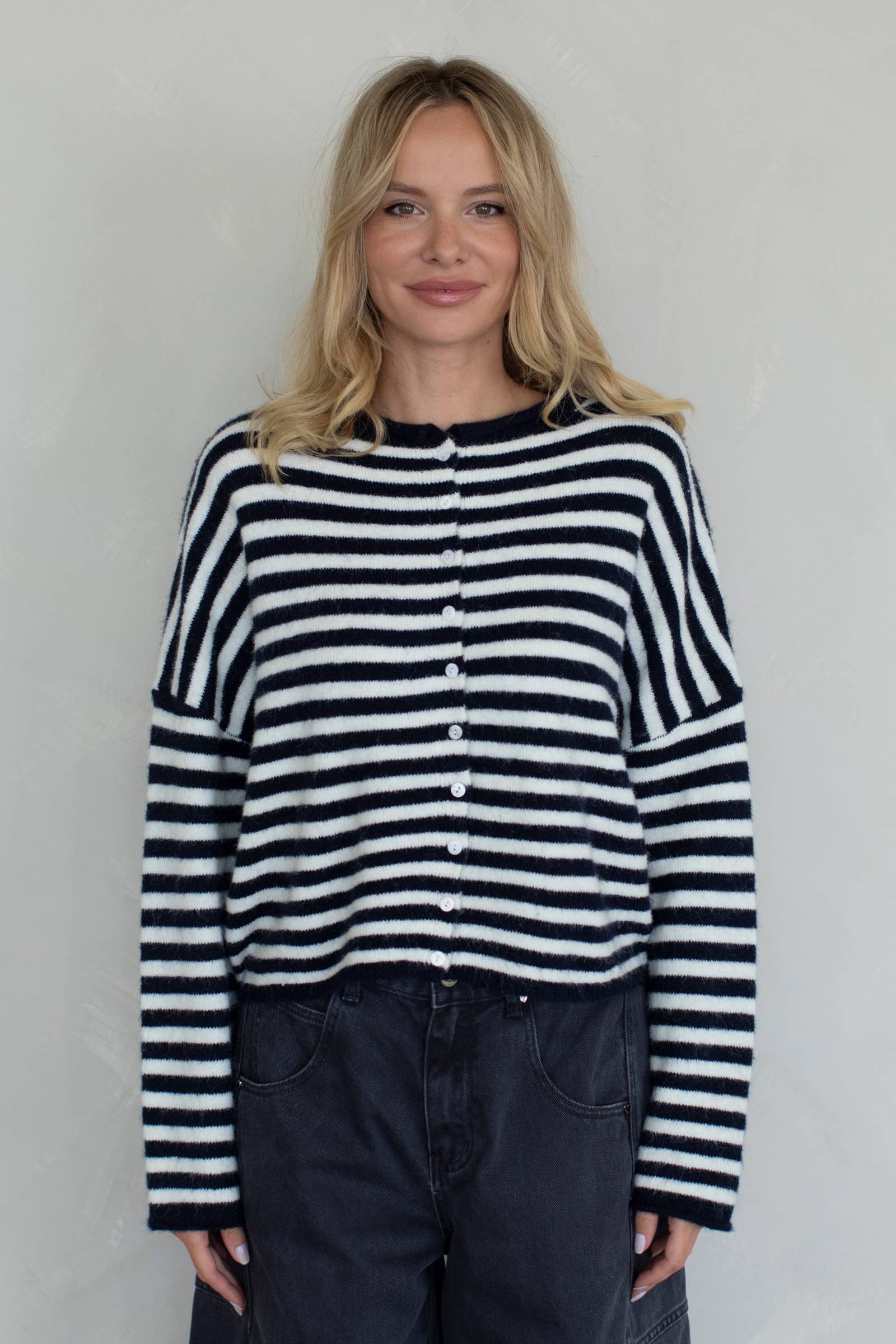Woman wearing a black and white striped sweater