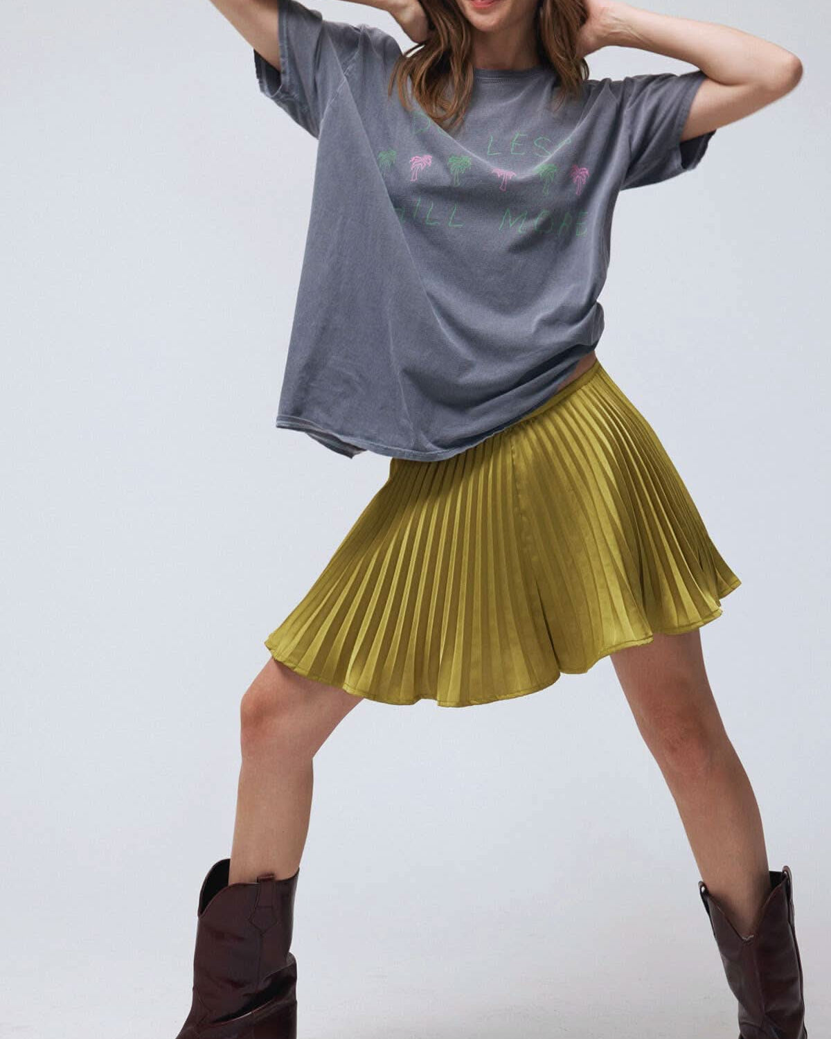 look of a mini skirt with the comfort of built-in shorts, it features crisp pleats that add movement and shine.