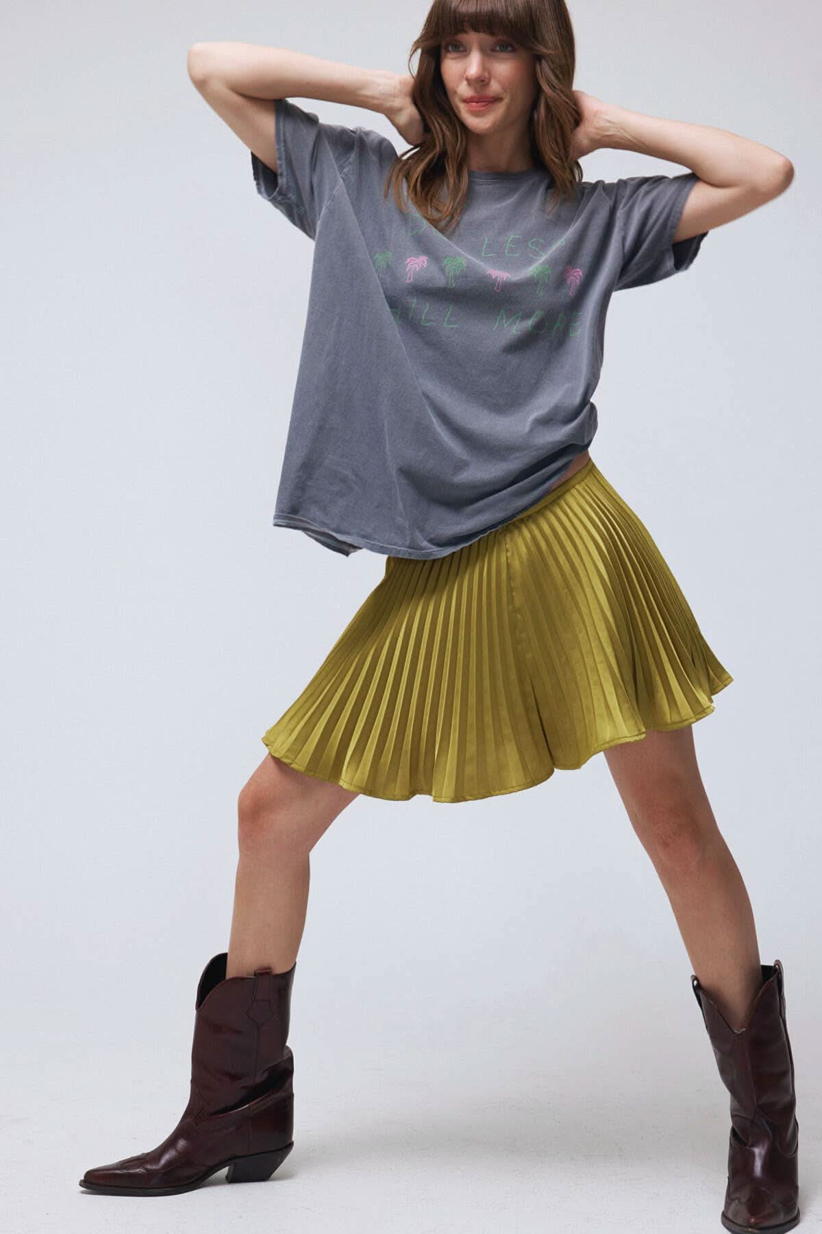 look of a mini skirt with the comfort of built-in shorts, it features crisp pleats that add movement and shine.