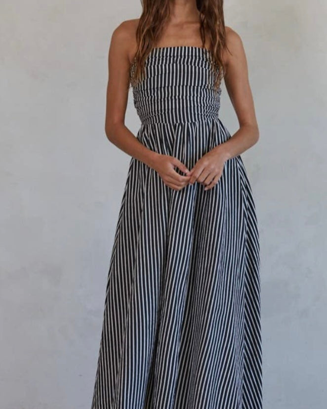 Promenade Maxi Dress Woman wearing a black and white striped dress