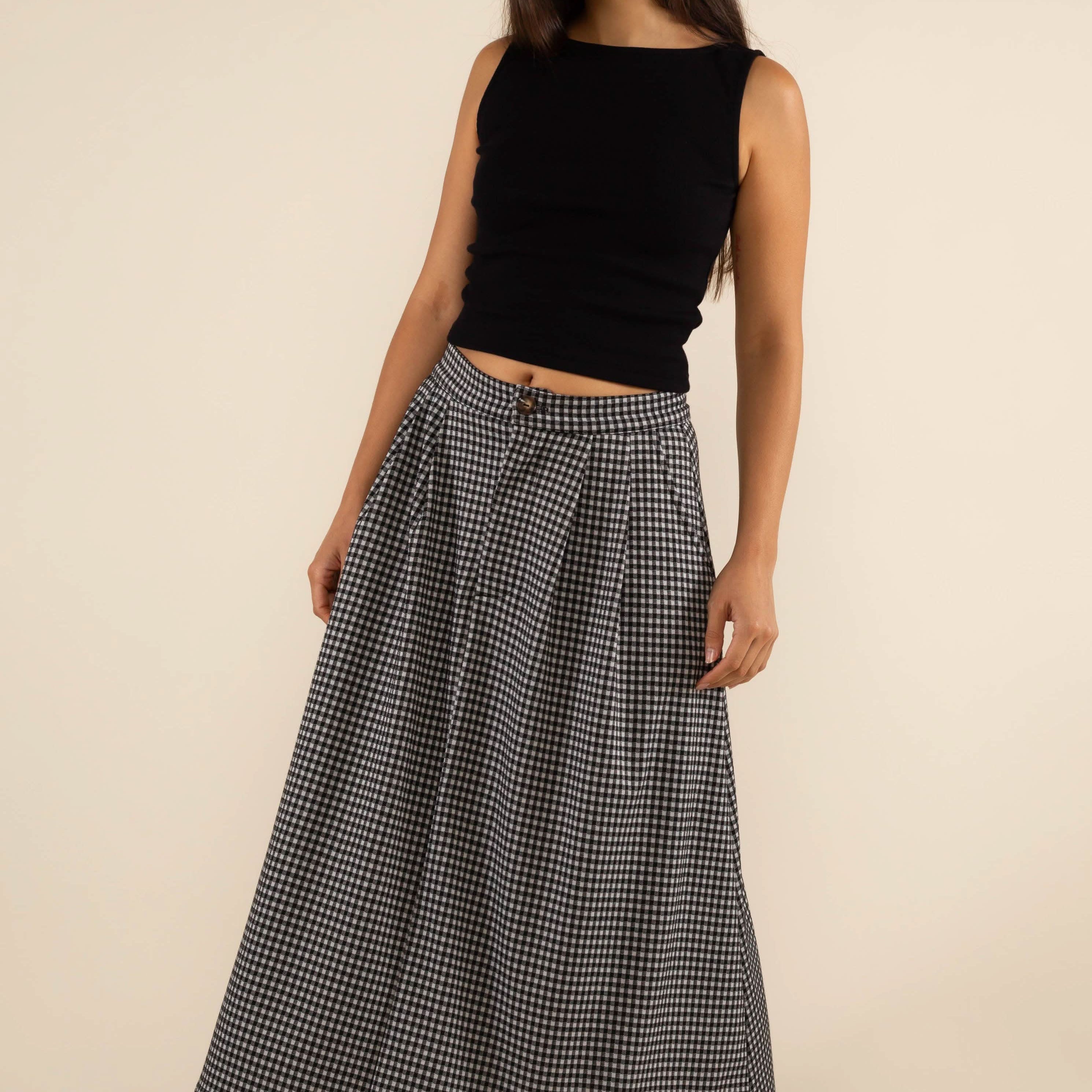 Woman wearing a long checkered skirt