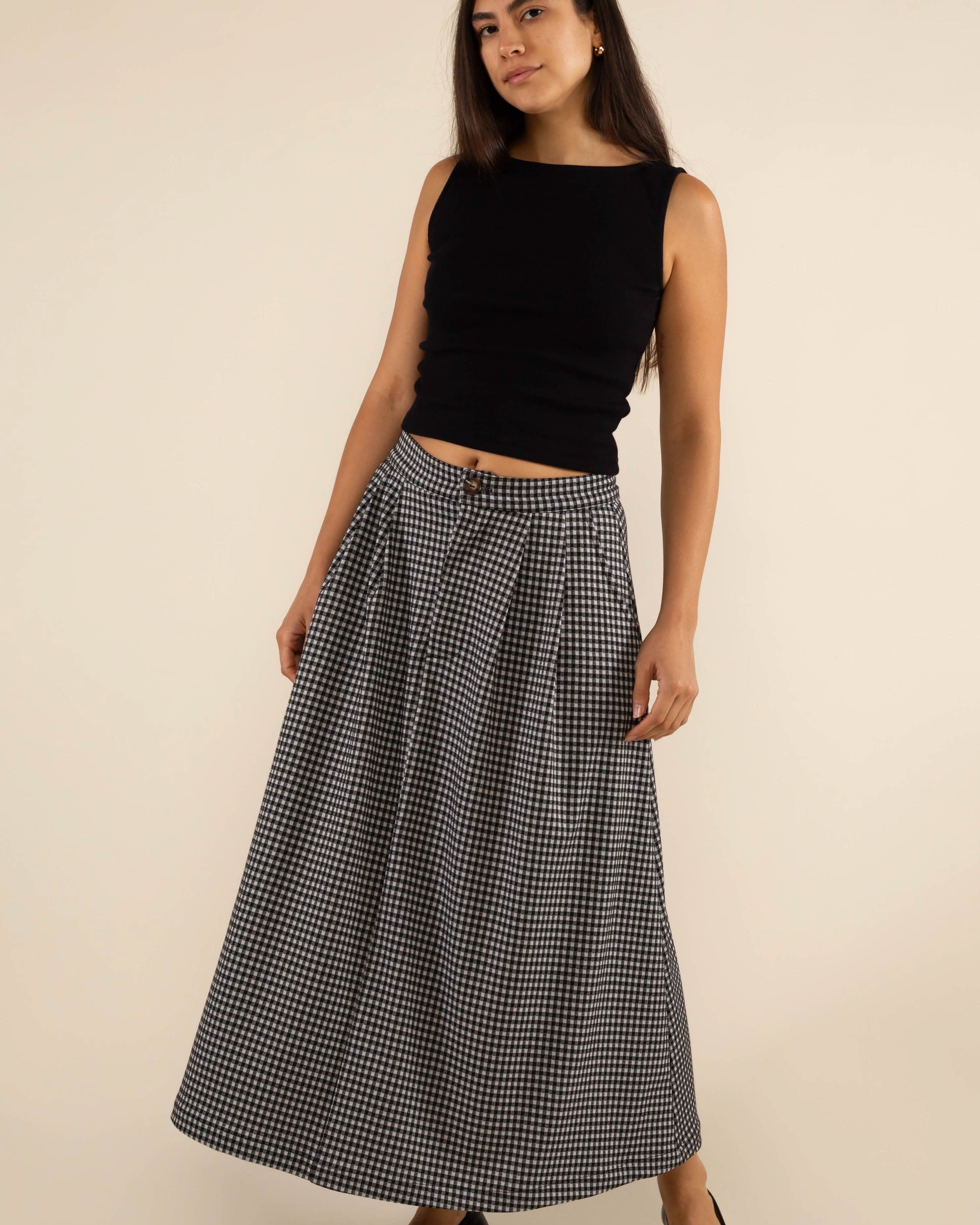 Woman wearing a long checkered skirt