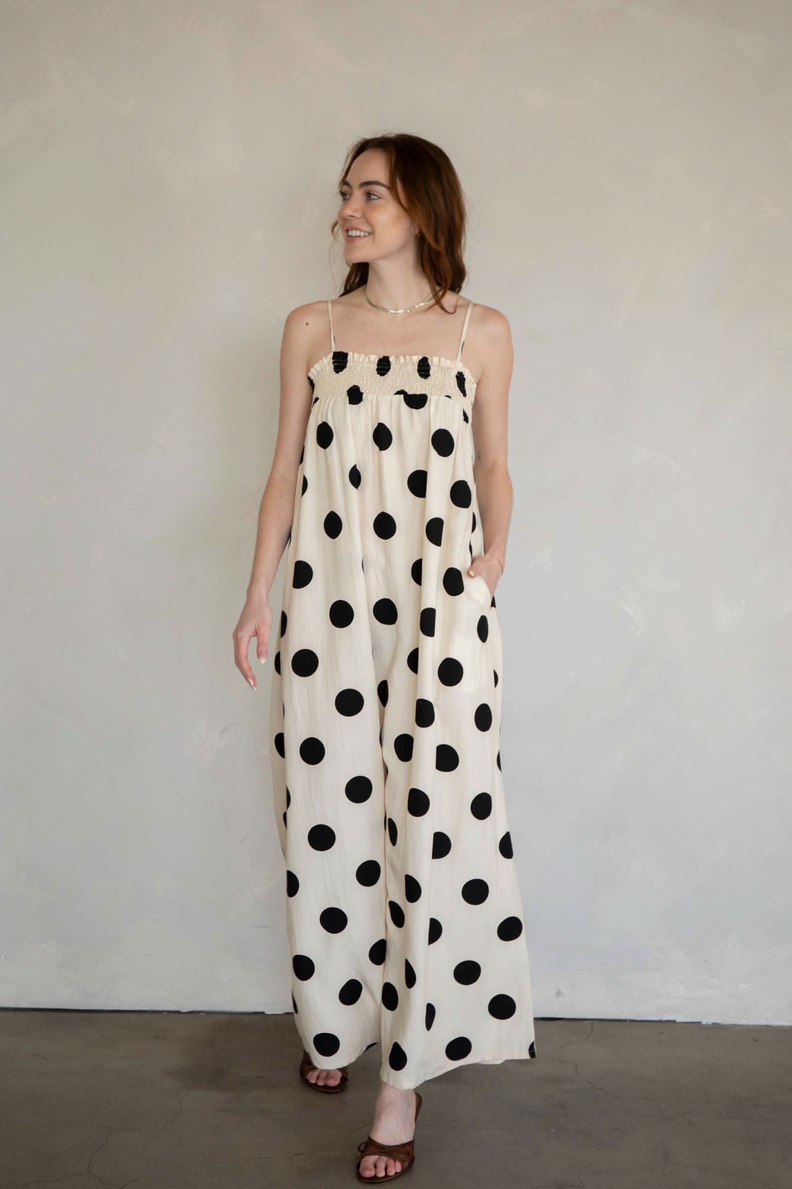 Cream Sandy Polka Dot Maxi Dress Woman wearing a polka dot dress