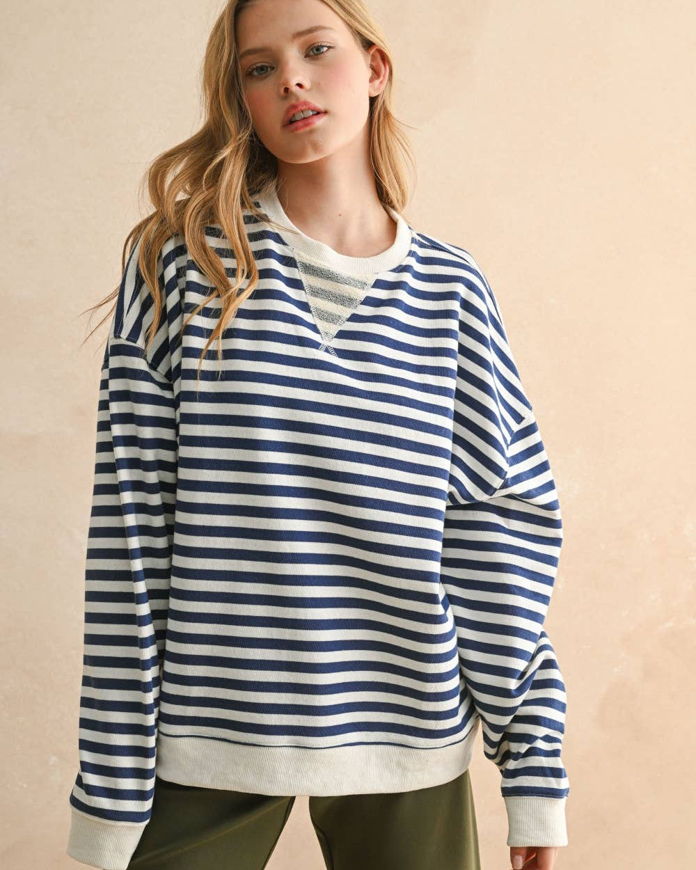 Woman wearing a blue and white striped sweater