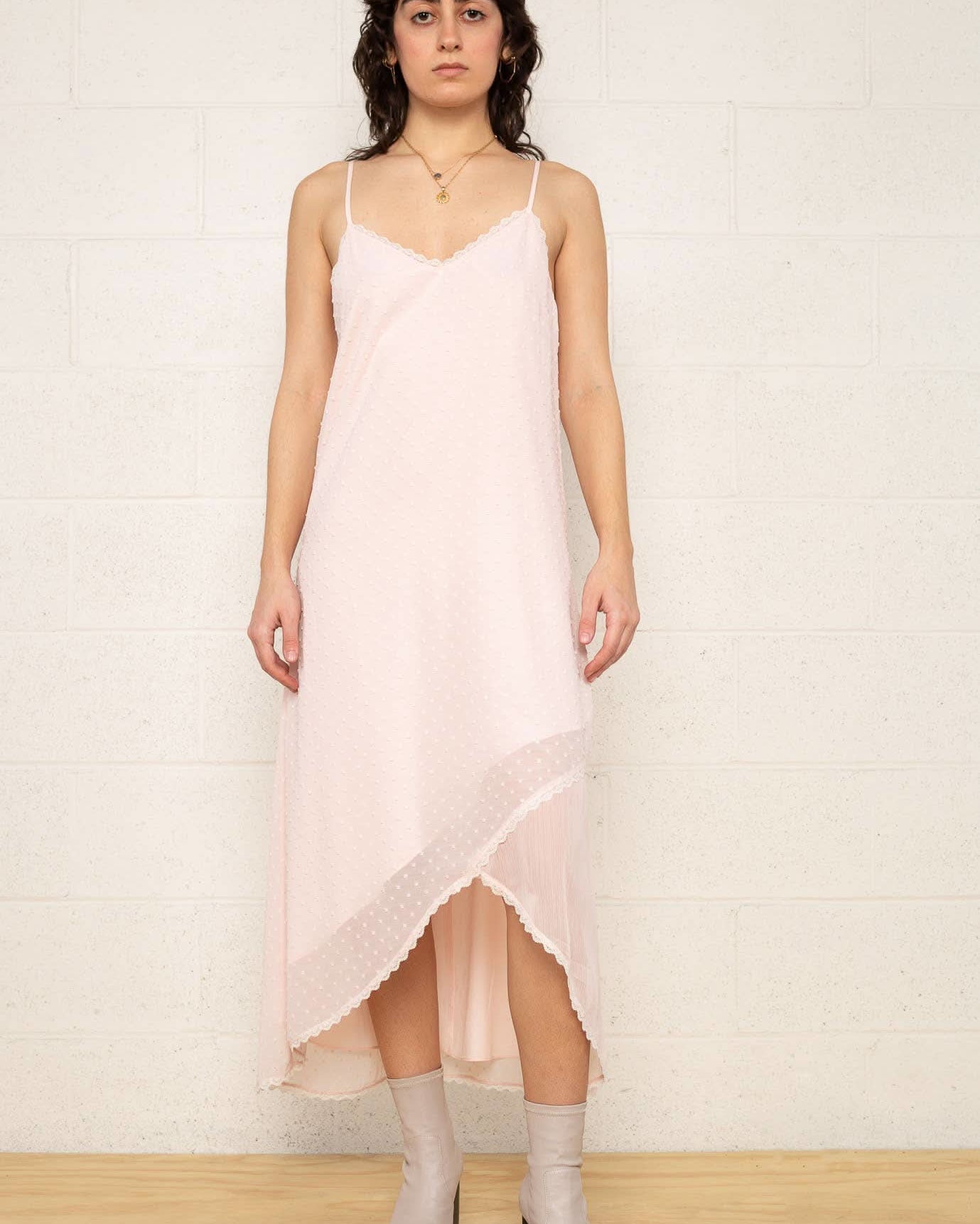 The Flirty Dress Woman wearing a light pink slip dress
