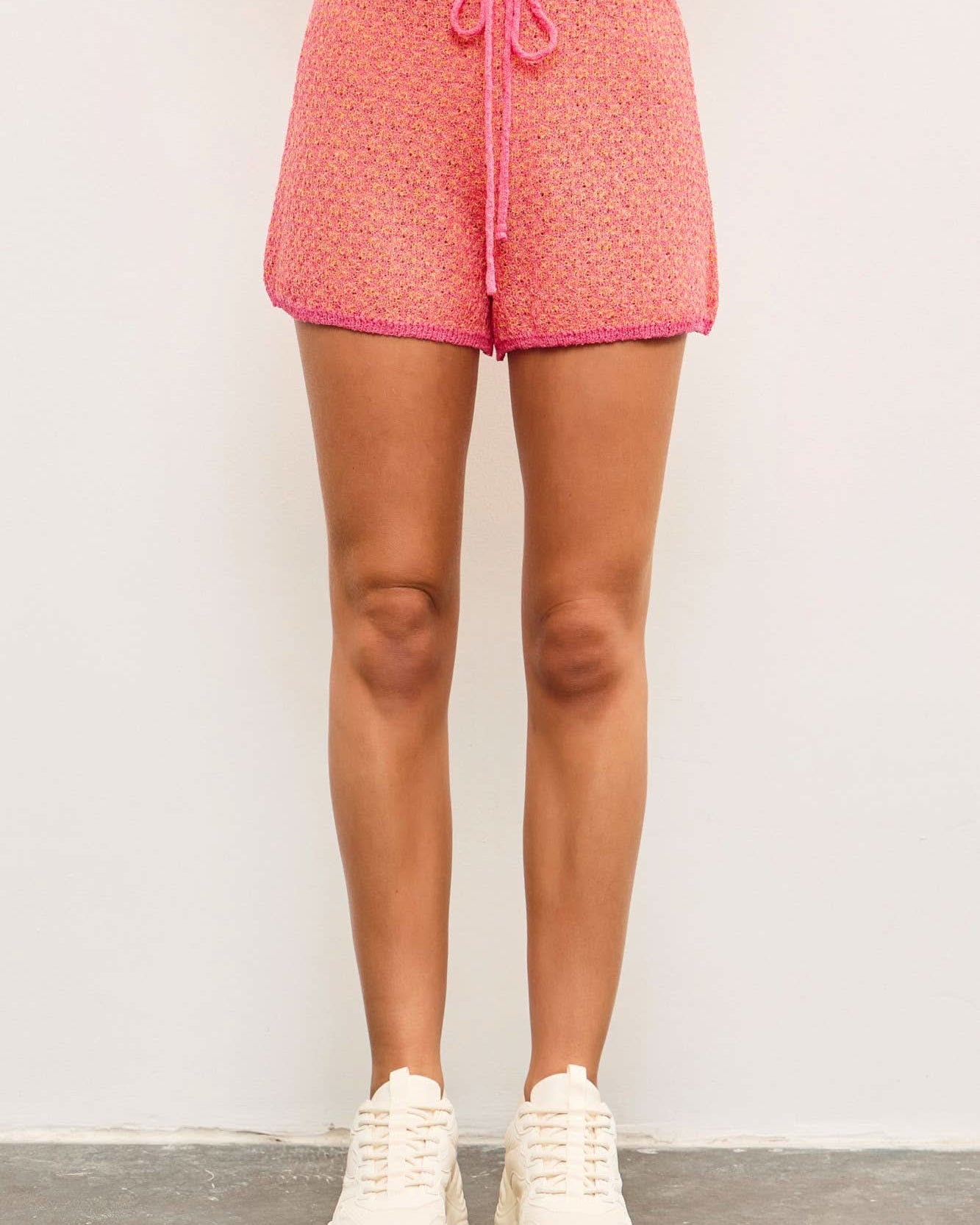 Person wearing pink shorts perfect for any occasion effortless style