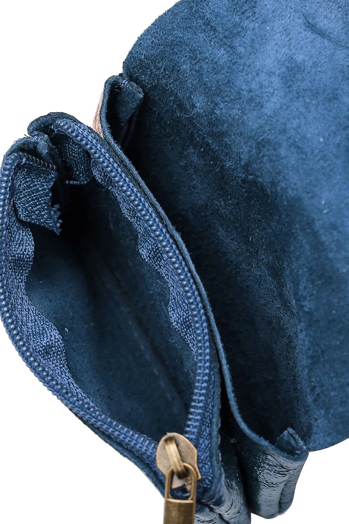 Open and unzipped view of Small blue metal wallet with over flap and gold button clasp 