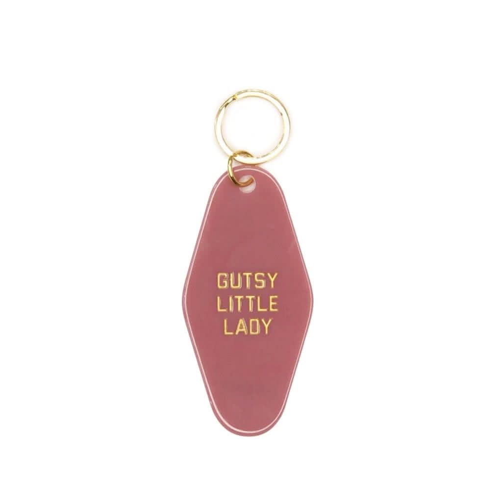 Dusty pink Gutsy Little Lady motel keychain
