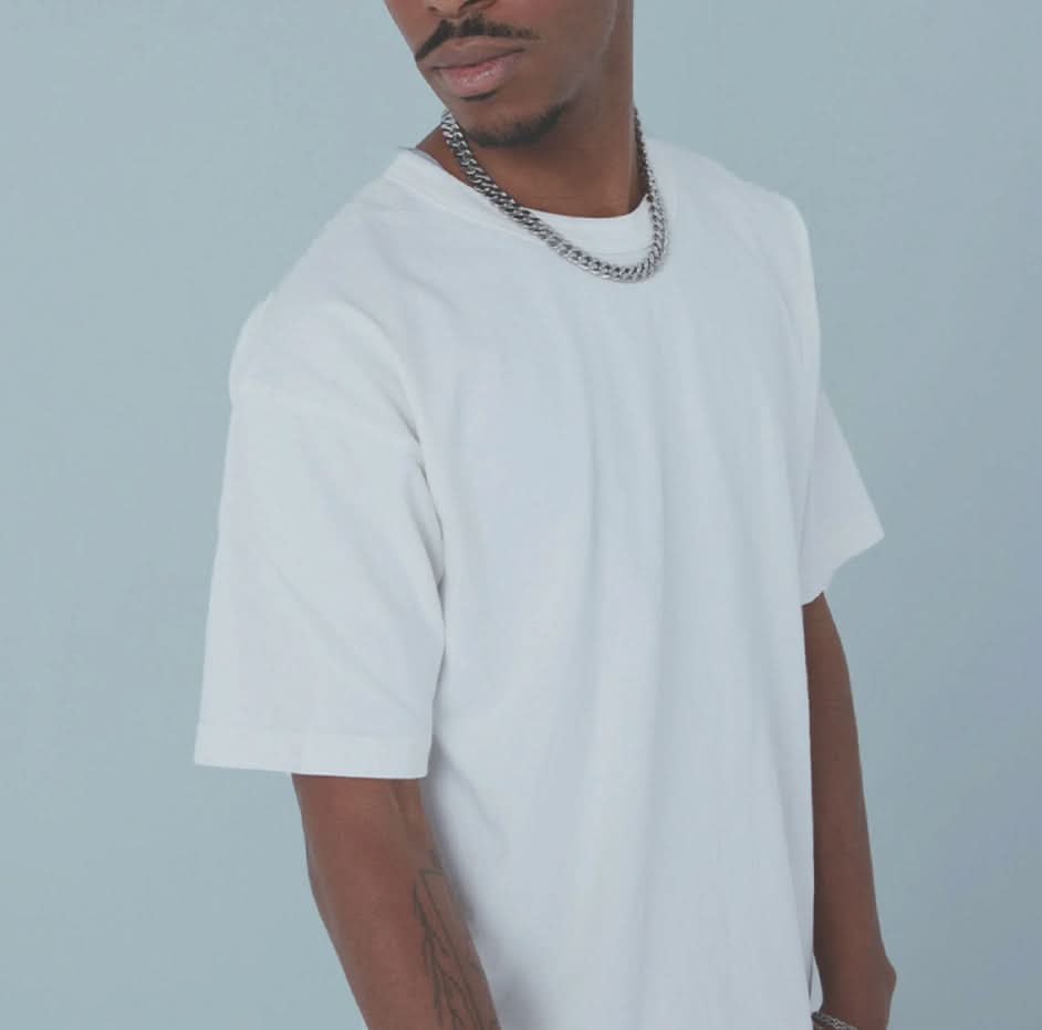 Man wearing white vintage, washed, oversized, box, tee t-shirt on white background  